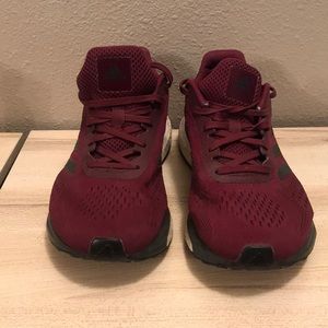 Maroon Adidas athletic shoes